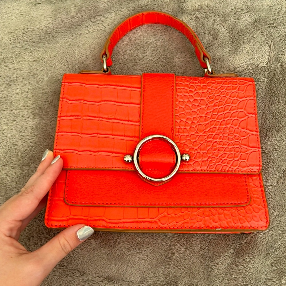 Never worn small purse. Anne Klein coral color.